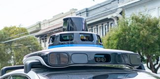 A Waymo self-driving car is seen in the Inner Richmond neighborhood of San Francisco, California, with the Lidar unit on the vehicle visible, November 17, 2024.